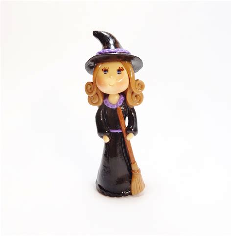 Embrace the mystical with a little witch figurine for your cake